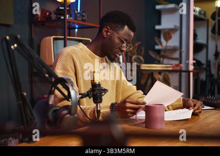 Journalist Reading Content Plan Before Podcast Stock Photo