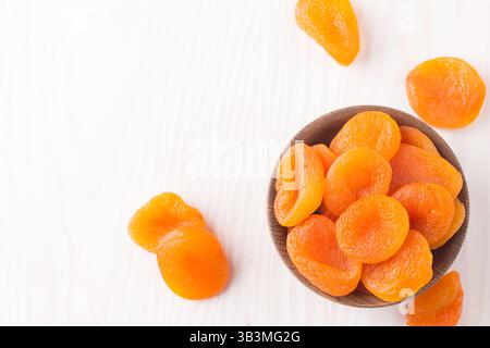 Dried apricots in a bowl. Dried fruits. Stock Photo