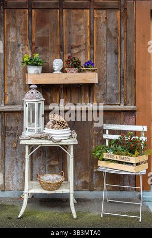 Traditional Alps wooden chalet with vintage, sweet decoration for cozy atmosphere in front door Stock Photo