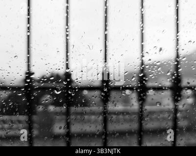 Raindrops on a window with a grid. Spain, Europe Stock Photo