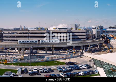 Editorial image of JFK Airport’s AirTrain and parking structure with construction activity during the ongoing $19 billion redevelopment. Stock Photo
