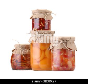 Many jars with different pickled products isolated on white Stock Photo