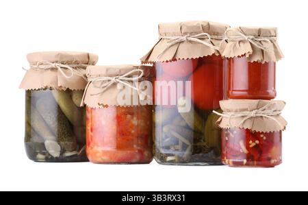 Many jars with different pickled products isolated on white Stock Photo