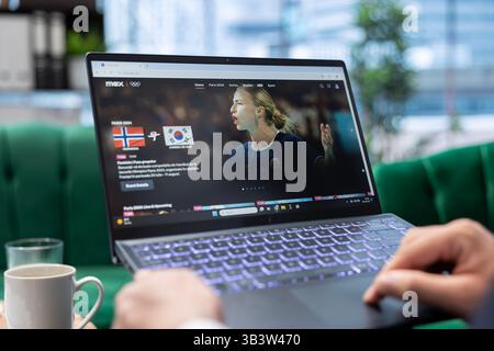 Bucharest, Romania - July 30th 2024 - Man navigating Max streaming platform in order to find a movie or tv show, looking to relax in his office. Young leader at the business corporation. Stock Photo