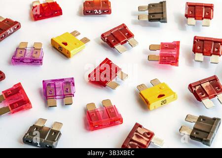 Close-up of a chaotic assortment of automotive fuses in various colors and ratings — ideal for illustrating car electronics, repairs, or spare parts Stock Photo