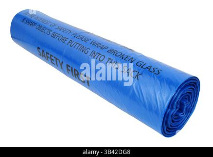 Roll of blue plastic bin bags with warning text printed on each bag isolated on a white background Stock Photo