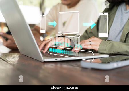 File transfer, data migration, transmission, backup files concept. Loading progress bar and smartphone sending to computer icons appear while person u Stock Photo