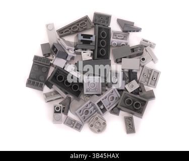 Pile of plastic construction kit parts isolated on white background Stock Photo