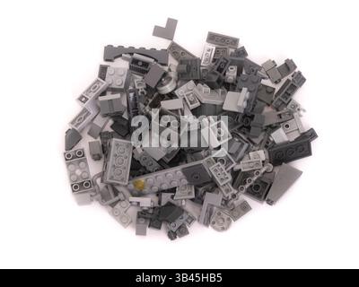 Pile of plastic construction kit parts isolated on white background Stock Photo