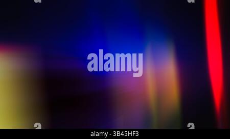 Colorful glow Light flare sparks texture. red orange rays on dark blue abstract overlay. A beautiful abstract composition featuring out-of-focus light Stock Photo