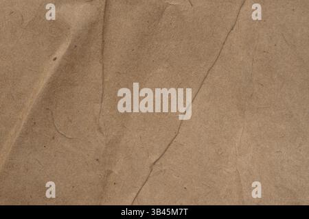 Grunge vintage old paper background. Brown crumpled paper texture. Stock Photo