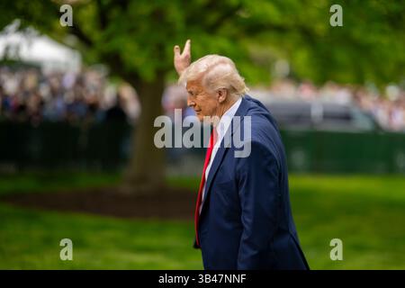 President Donald Trump waves as he departs the Presidents Cup golf ...
