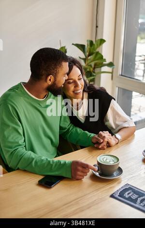 African American couple shares a warm embrace at home in the kitchen ...