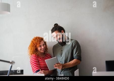 Software, coding and business woman on tablet thinking of data analytics, digital technology. Stock Photo