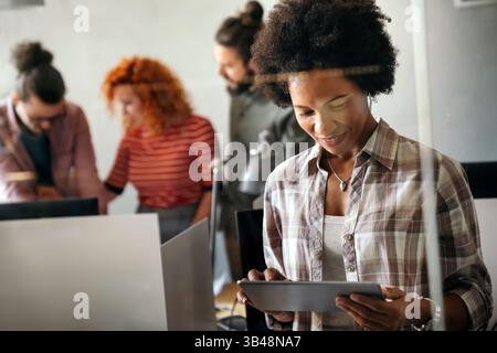 African american woman with tablet, innovation in research and programming for future app technology Stock Photo