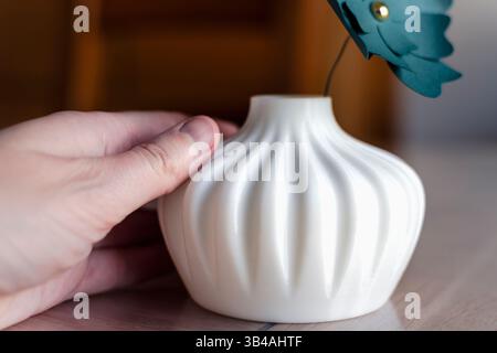 Small white single flower vase 3d printed from corn starch pla filament, ideal for dried or artificial flowers Stock Photo