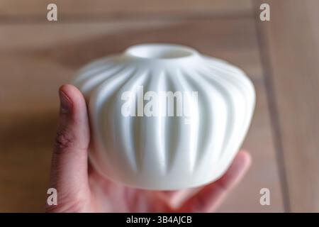 Small white single flower vase 3d printed from corn starch pla filament, ideal for dried or artificial flowers Stock Photo