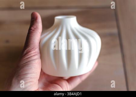 Small white single flower vase 3d printed from corn starch pla filament, ideal for dried or artificial flowers Stock Photo