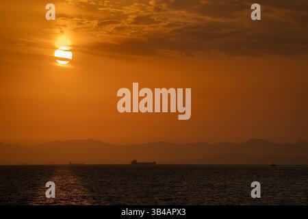 Sunset over China with an orange sky Stock Photo