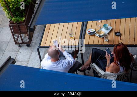 people on their phones seen from above Stock Photo