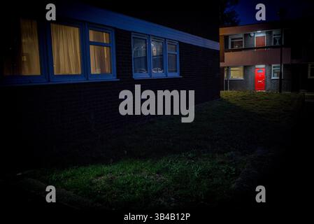 housing estate red door, twilight Stock Photo
