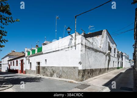 Stroll through Barrio Alto, Sanlucar de Barrameda, where typical whitewashed buildings showcase the charm of Mediterranean architecture. Stock Photo