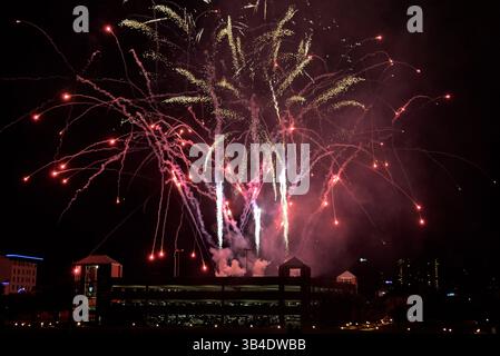 Fireworks are set off from the top of a stand ahead of the