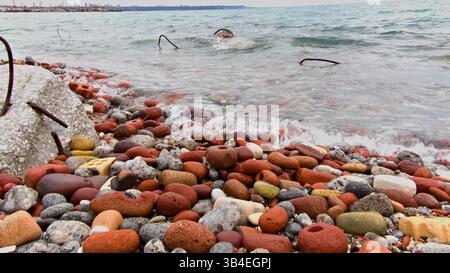 Natural textures formed from artificial ruins washed by Ontario water. This pattern of shapes and colors is ideal for eco-themed design. Stock Photo