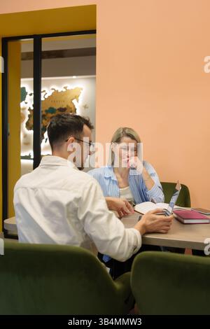 Professional collaboration between colleagues in a modern office space setting Stock Photo