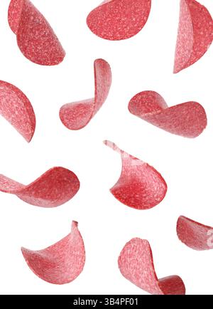 Salami sausage slices flying on white background Stock Photo
