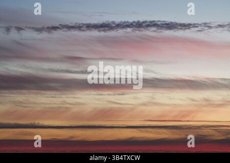 An incredible evening sky. Abstraction. Horizontal photo of clouds at sunset. Stock Photo