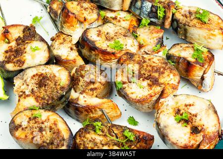 Barbecue, grill or kebab. Fish kebabs on skewers. Grilled fish. Close up Stock Photo