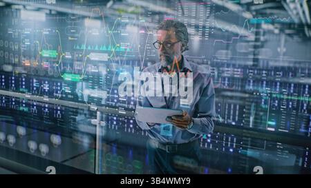 Futuristic Big Data Center with VFX: Specialist Using Tablet Computer. Animated Charts of Cloud Computing and Internet Traffic on Servers. Information Technology, Digitalization Concept. Medium Shot. Stock Photo