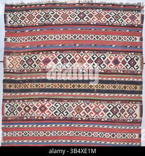 A second-half 19th-century Shirvan Kilim woven by unknown weavers. This kilim features wide ivory bands with hooked medallions and narrow red bands likely made from cochineal or madder. The piece includes geometric shapes and figures resembling men with hats, providing a unique blend of regional weaving techniques and cultural motifs. Stock Photo