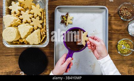 Chocolate Dipped Reindeer Cookies on Baking Sheet Stock Photo