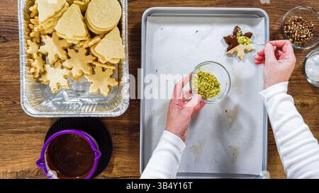 Chocolate Dipped Reindeer Cookies on Baking Sheet Stock Photo