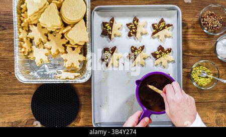 Chocolate Dipped Reindeer Cookies on Baking Sheet Stock Photo