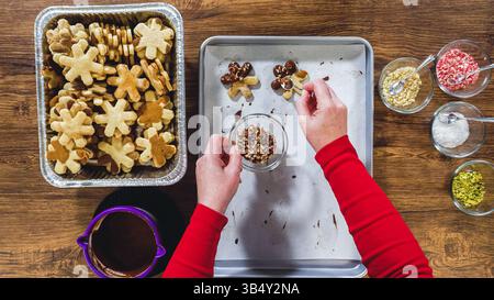 Chocolate Dipped Reindeer Cookies on Baking Sheet Stock Photo