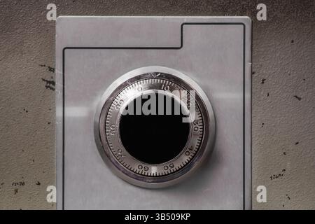 Security safe with mechanical combination lock or dial safe lock. Close up. Wheel combination lock with analog numbers. Close up of old fire proof ste Stock Photo