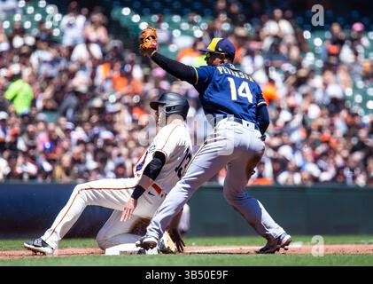 July 17 2022 San Francisco CA, U.S.A. San Francisco center fielder Austin Slater (13) gets tag out at by Milwaukee third baseman Jace Peterson (14) during MLB NL west game between the Milwaukee Brewers and the San Francisco Giants. The Giants won 9-5 at Oracle Park San Francisco Calif. Thurman James / CSM (Credit Image: © Thurman James/CSM via ZUMA Press Wire) Stock Photo