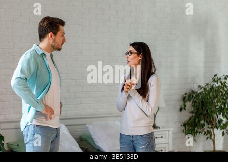 Couple Having Serious Conversation at Home Stock Photo