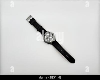 Steel black mechanical watch with gray dial and sapphire crystal on white background top view Stock Photo