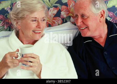 Senior couple close up in night clothes indoors at home. Stock Photo