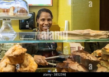 Detroit, Michigan - A young worker fills orders at Plum Market in Detroit Metro Airport. Stock Photo