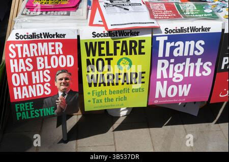 May 1st 2025 Celebrating May Day.,  Clerkenwell Green, London. Socialist Worker posters attacking Starmer, Welfare not Warfare and Trans Rights now. Stock Photo