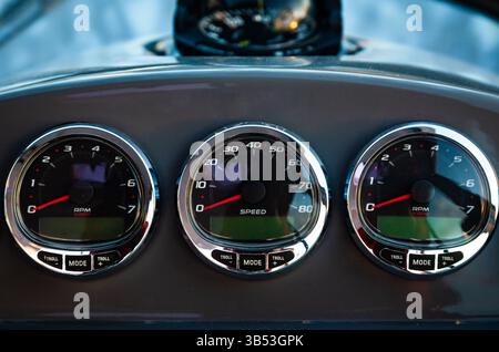 Motor yacht control panel. Gauges, speedometers and control buttons. Stock Photo