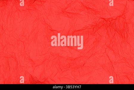 Red crumpled tissue paper texture background detail Stock Photo