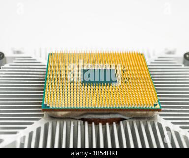 Pin side of a CPU processor mounted on a cooler Stock Photo