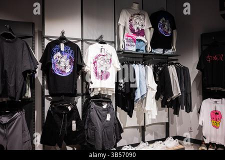 Mannequins in stylish T-shirts and jeans in the clothing department of ...