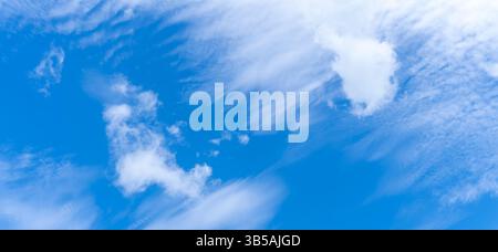 Low angle view and full frame of beautiful blue sky with strange shape of thin white clouds in the morning or afternoon  on sunny day Stock Photo